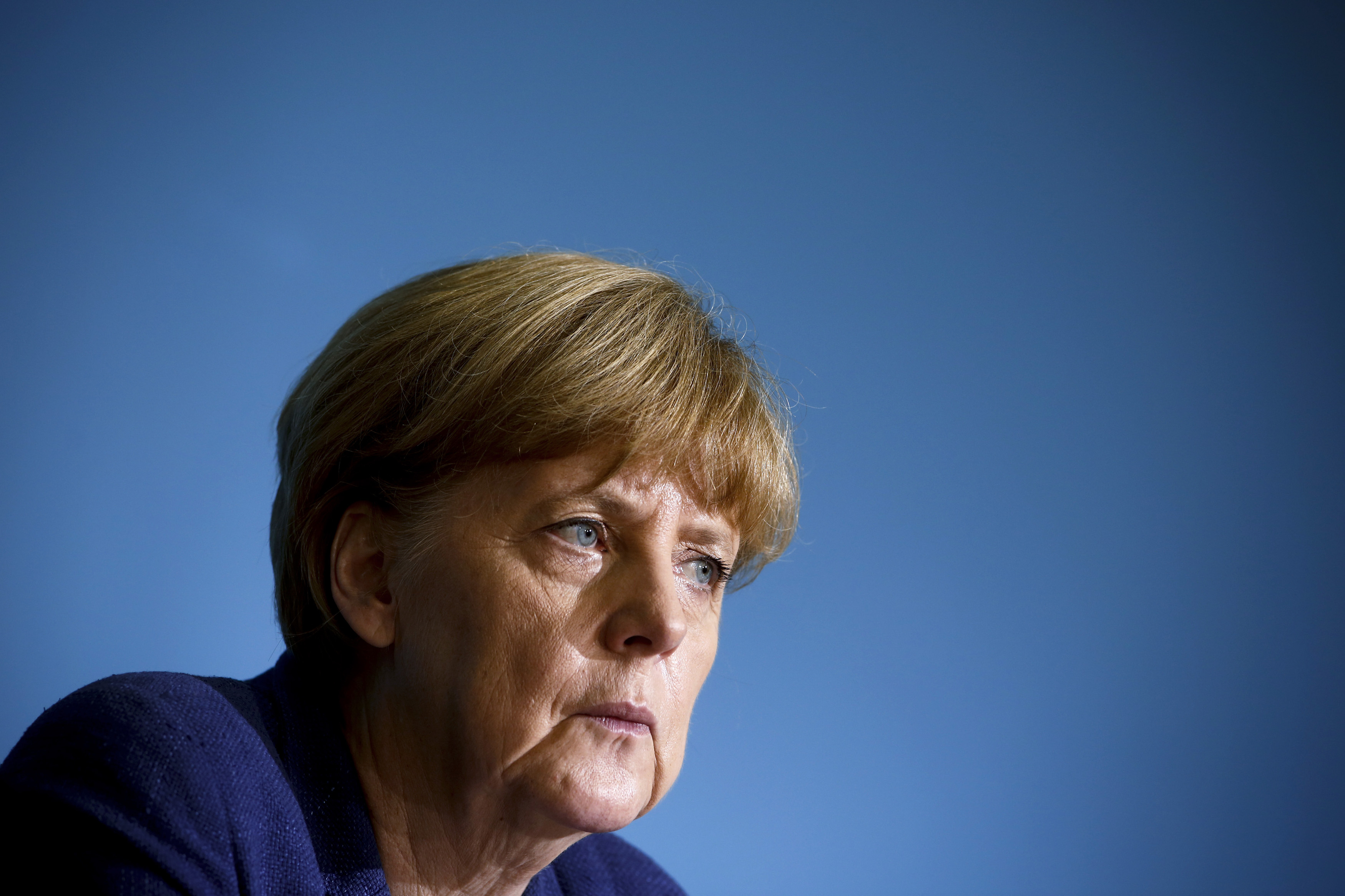 German Chancellor Angela Merkel attends a news conference after a meeting with East German state premiers in Berlin